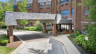 Entrance of a senior living facility with a covered walkway