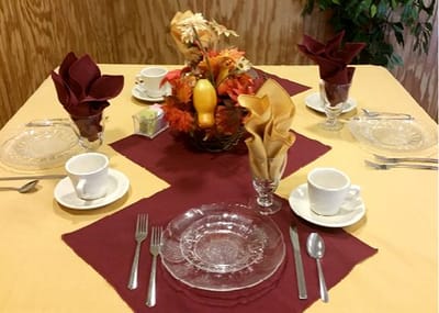 Beautifully set dining table with fall decorations
