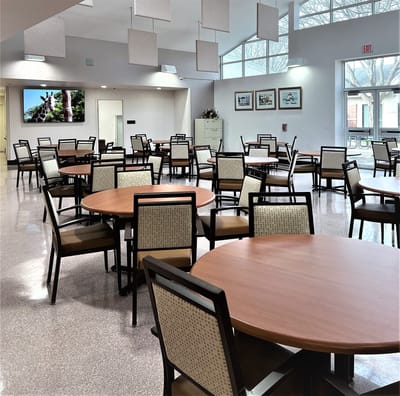 Bright dining room with circular tables and chairs