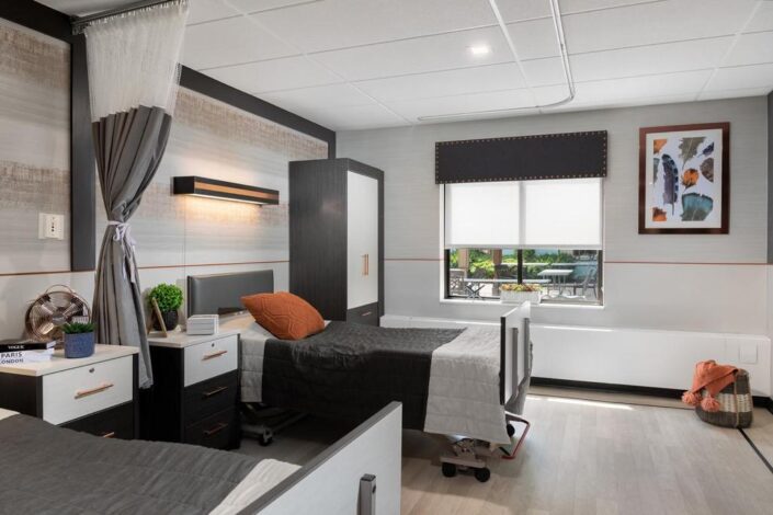 A twin resident room with modern decor and natural light