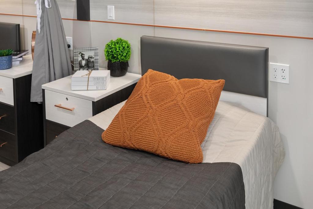 Cozy private resident room with a bed and decor