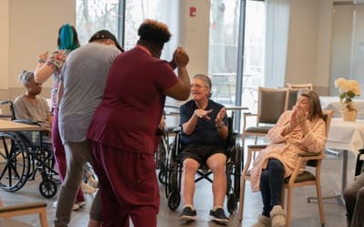 Residents enjoying a lively activity in the common area