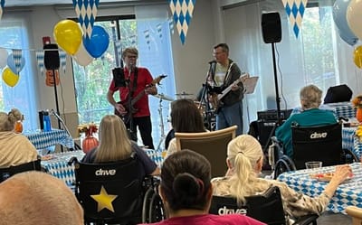 Residents enjoying live music in a common area