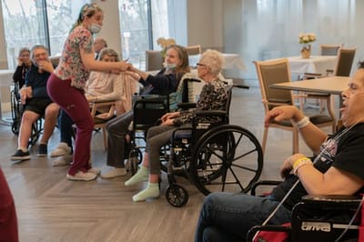 Residents participating in a group activity in a common area