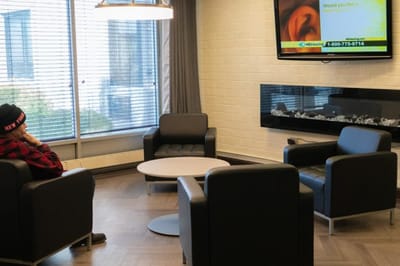 A cozy lounge area with seating and a television