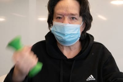 Resident exercising with dumbbell indoors