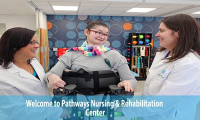 Therapist assisting a resident in a rehabilitation session