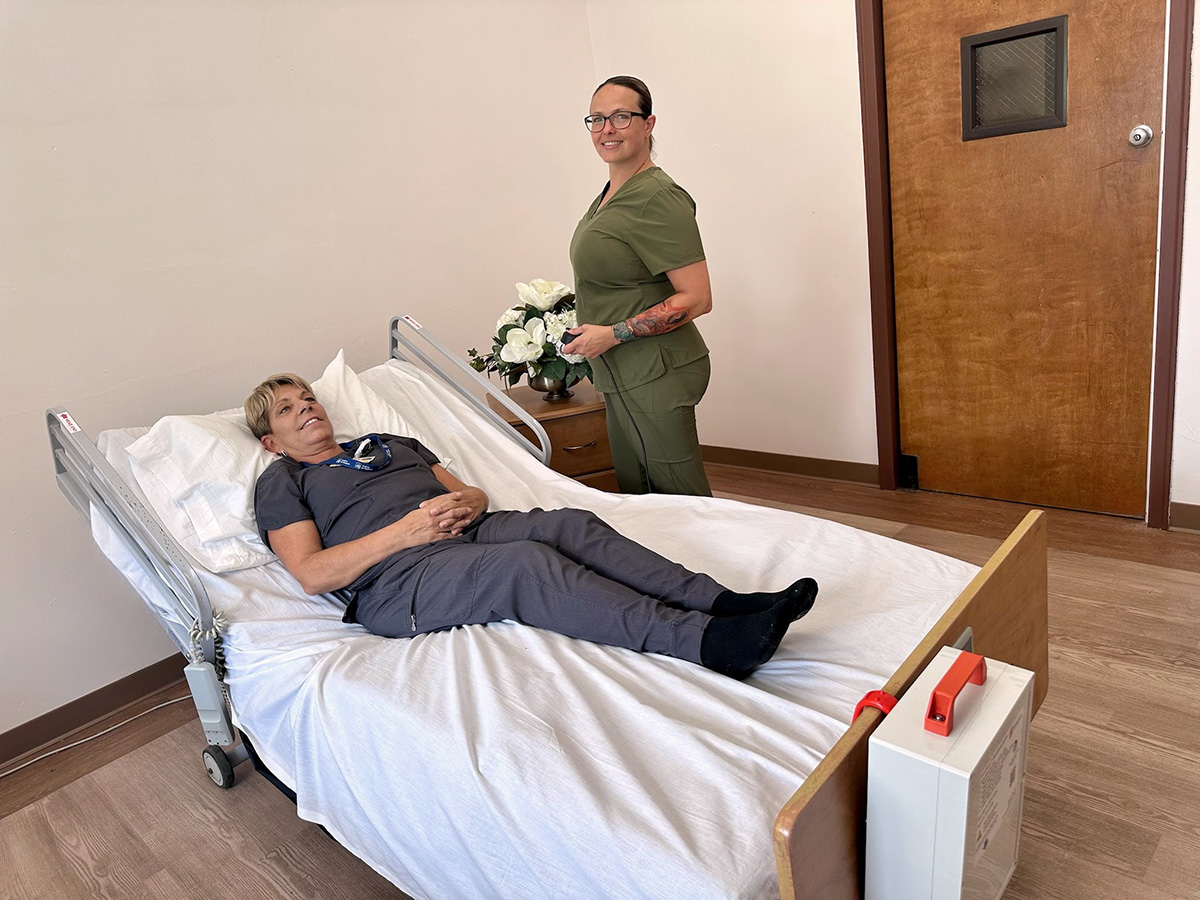 Staff member assisting a resident in a room