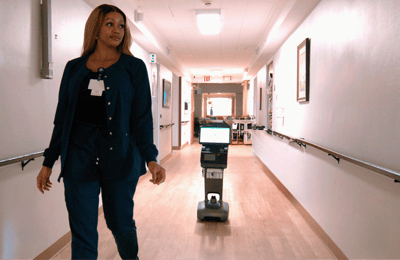 Staff member walking in a hallway of the facility