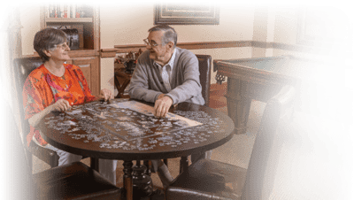 Residents enjoying a puzzle in a common area