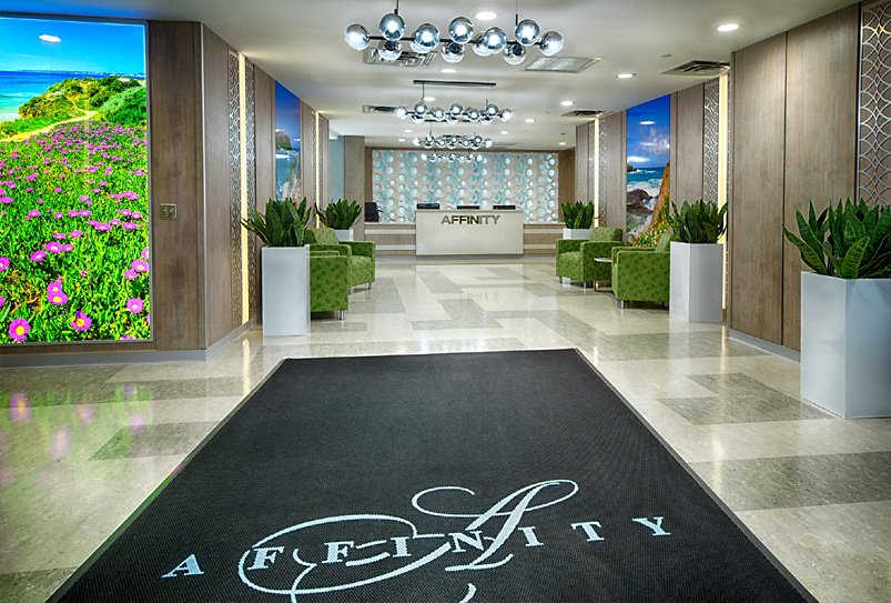 Bright lobby area with modern furniture and floral decor