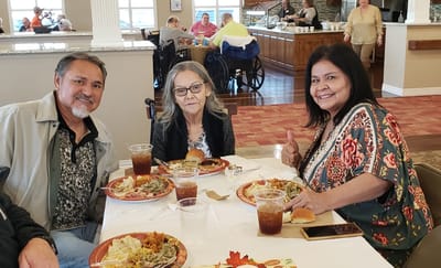 Residents enjoying a meal together in the dining area