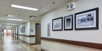 Interior hallway with framed photos on the wall