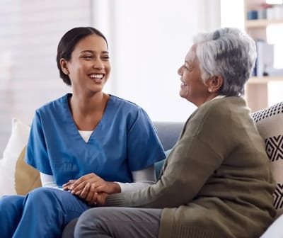 Caregiver and resident sharing a joyful moment