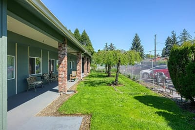 Garden area with seating near the facility exterior