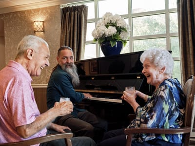Residents enjoying music together in a common area