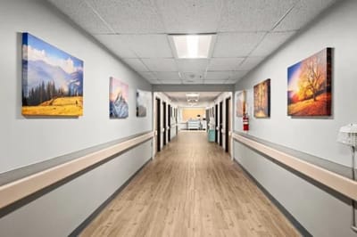 Bright corridor with framed landscape photographs