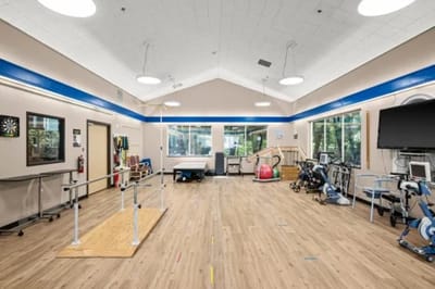 Bright activity room with therapy equipment and seating
