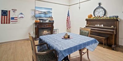 Cozy common area with decorations and a piano