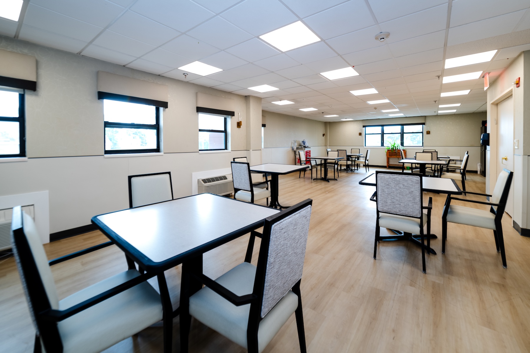 Bright dining room with tables and chairs
