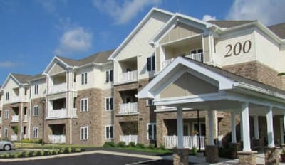 Exterior view of a senior living facility with balconies