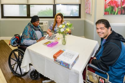 Park Terrace Care Center, Nursing Home in Rego Park, NY — Residents engaged in a creative activity at a table