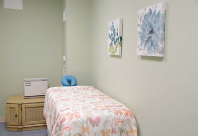 Cozy resident room with floral bedding and decor