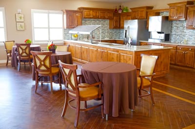Bright dining area with wooden cabinets and tables