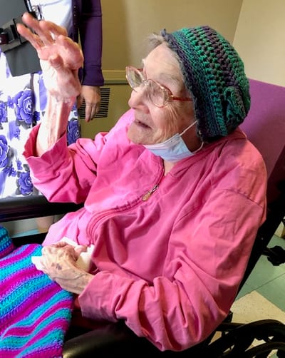 Resident gesturing happily during an activity