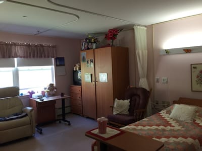 Cozy private room with a bed and seating area