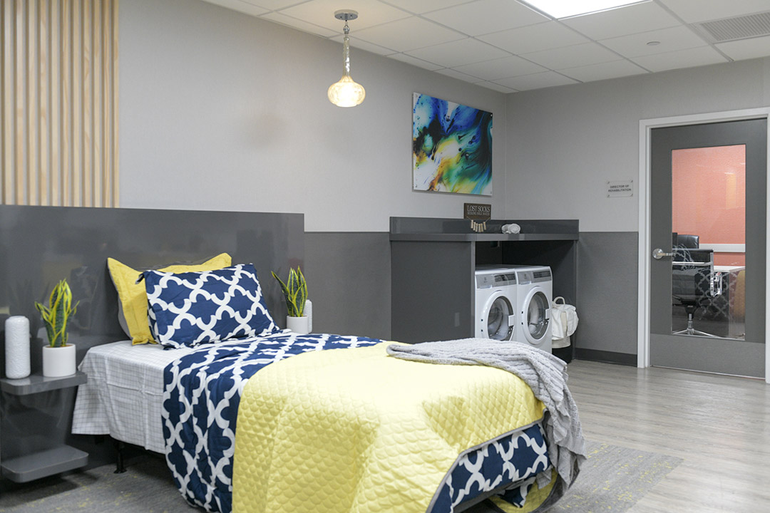 Cozy interior of a private resident room with laundry