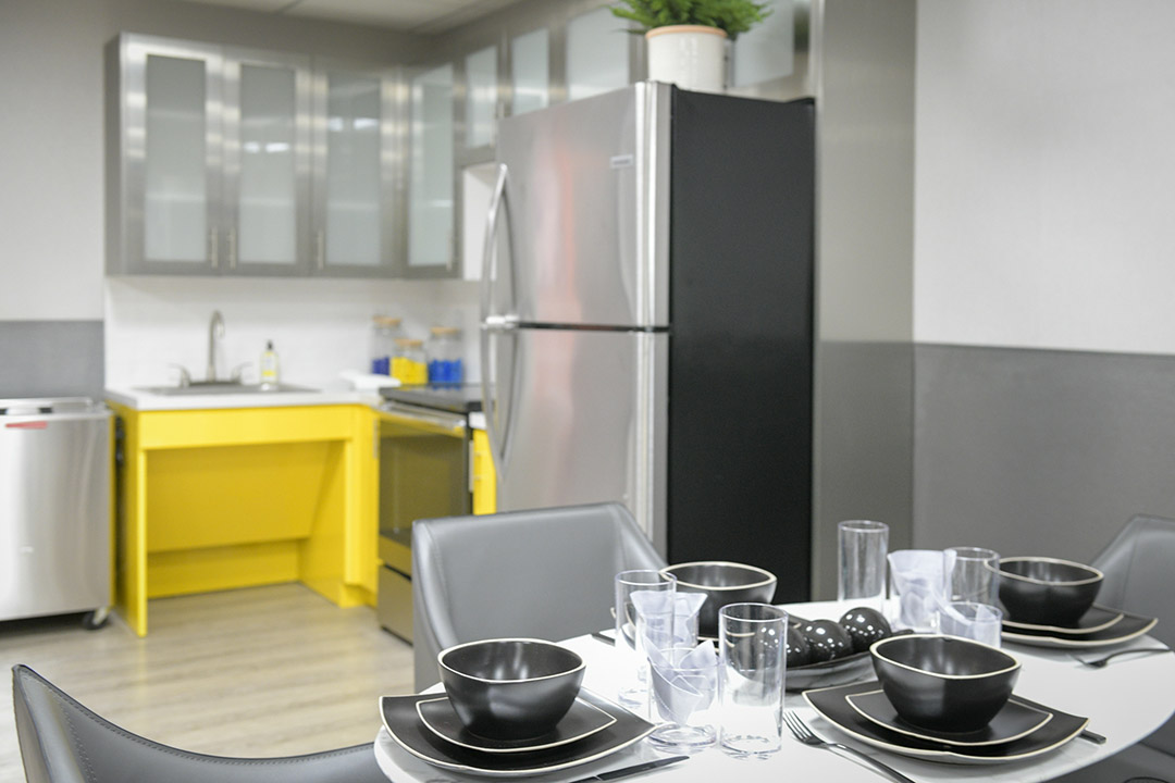Modern kitchen with dining table and appliances