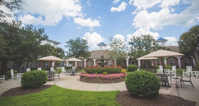 Beautiful outdoor courtyard with seating and flowers