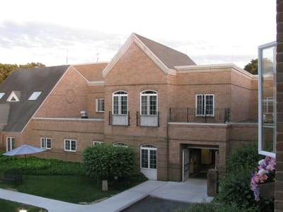 Exterior view of a brick nursing home facility