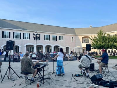 Residents enjoying a live music performance outdoors
