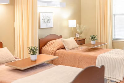 Cozy shared bedroom with two beds and soft lighting