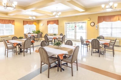 Dining area with tables set for residents