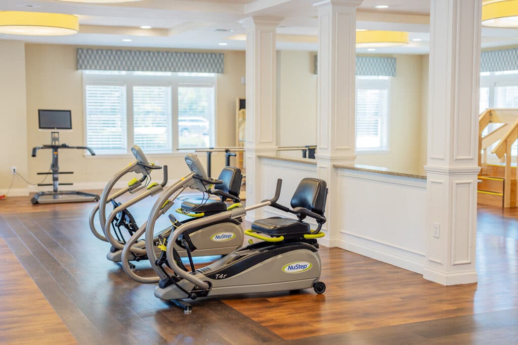 Exercise equipment in a well-lit gym area