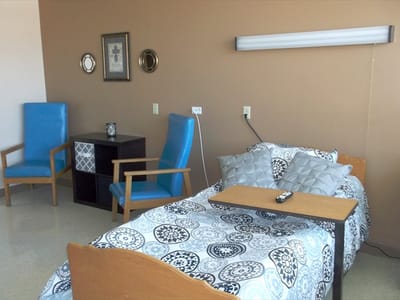 A cozy resident room with a bed and furniture