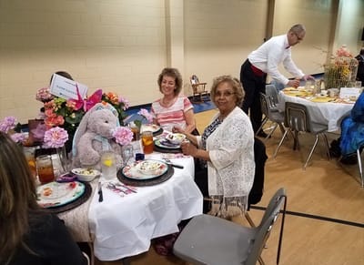 Residents enjoying a festive meal during a celebration
