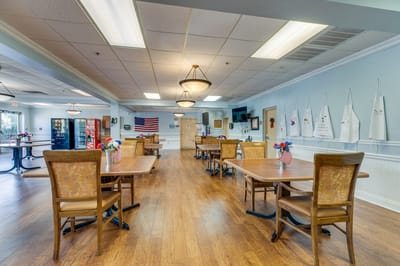 Bright dining room setup with tables and flags