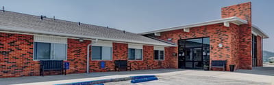 Exterior view of a brick senior living facility