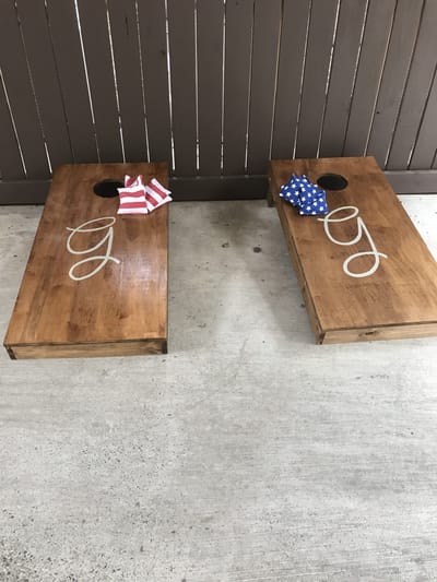 Bean bag toss game setup on a patio