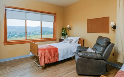 Cozy resident room with view and comfortable chair