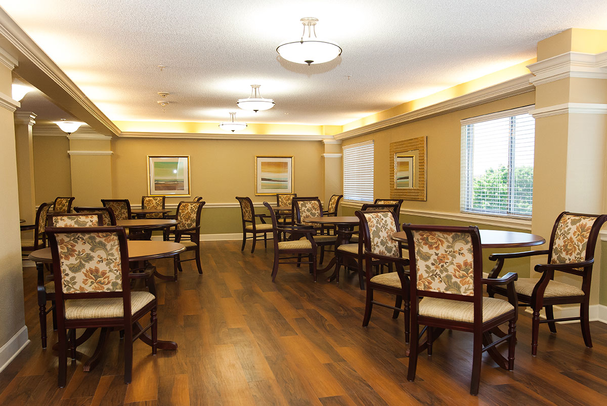 Bright common area with seating and tables