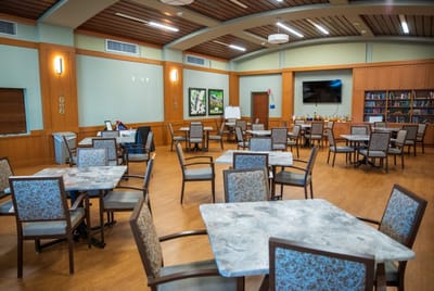 Bright common area with tables and chairs