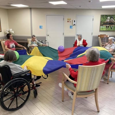 Residents participating in a colorful group activity