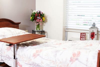 Cozy private resident room with flowers and messages