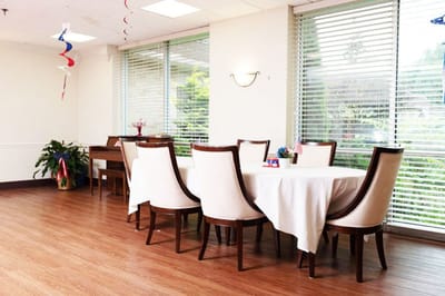 Bright dining area with a large table and chairs