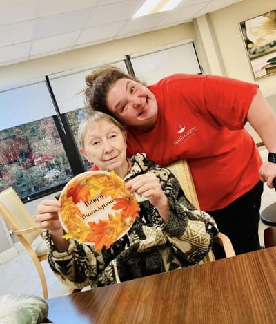 Resident and staff celebrating Thanksgiving together